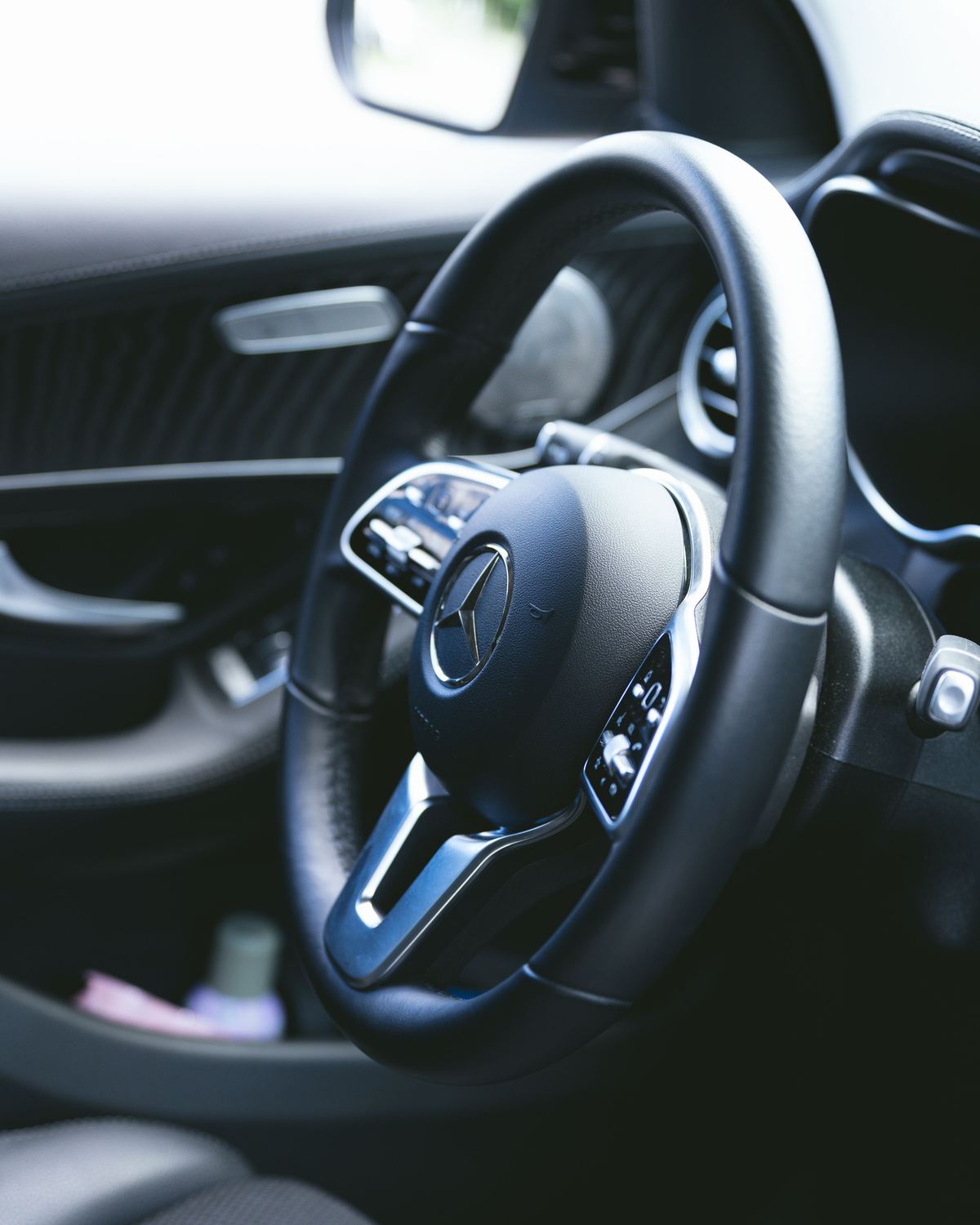 Close-up of a clean, conditioned steering wheel and dash after interior detailing
