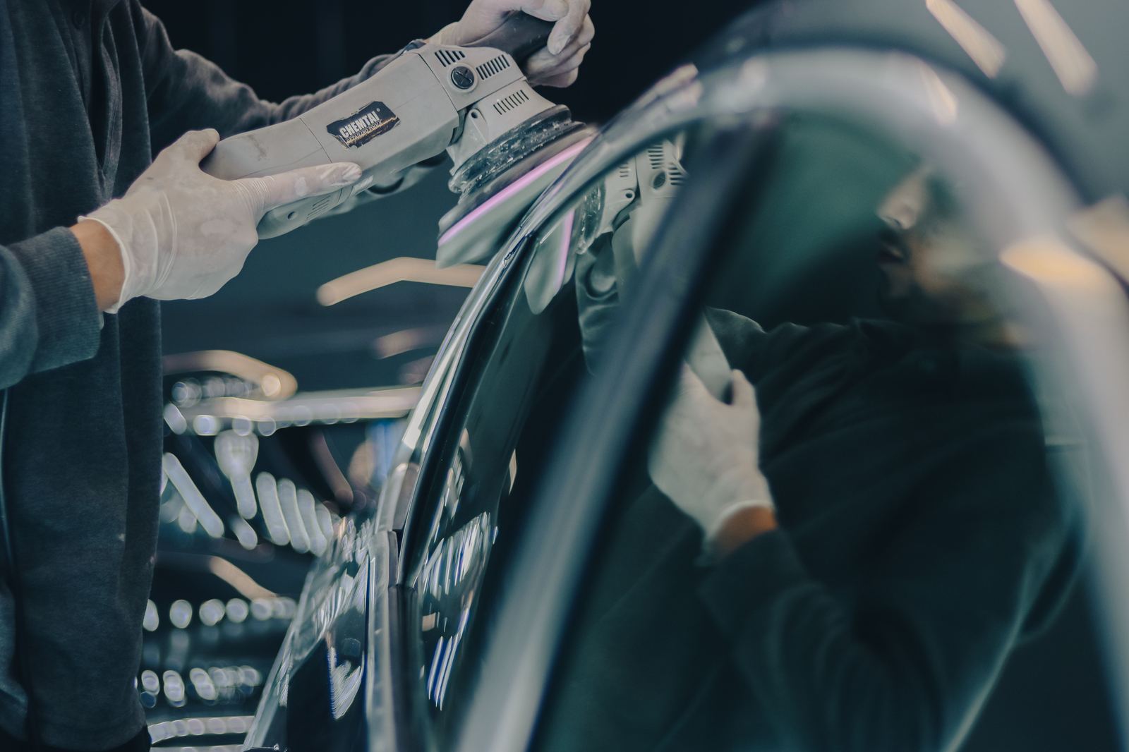 Hand polishing and paint correction on a vehicle by Pure Detailing Co.